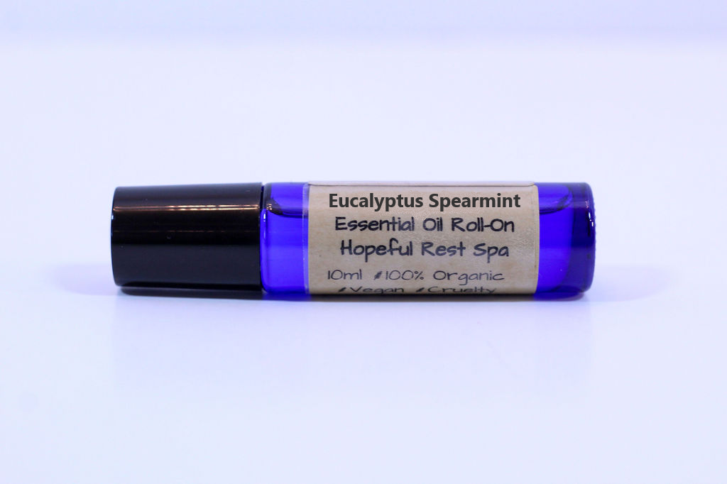 blue glass roller bottle on a white background