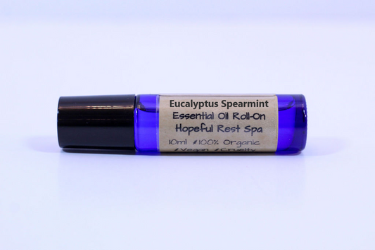 blue glass roller bottle on a white background