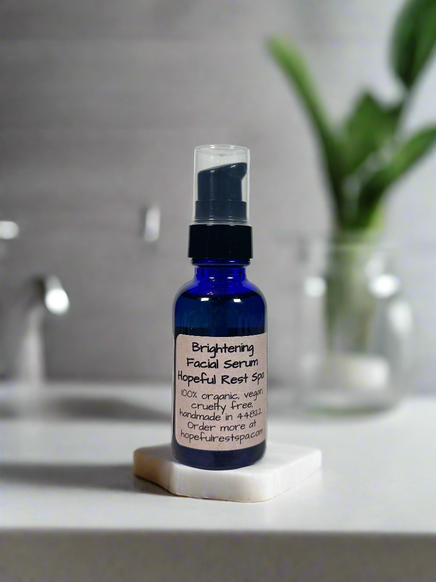 Blue facial serum bottle with a label on a bathroom counter